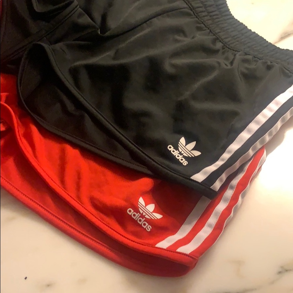 2 pairs of adidas trac shorts